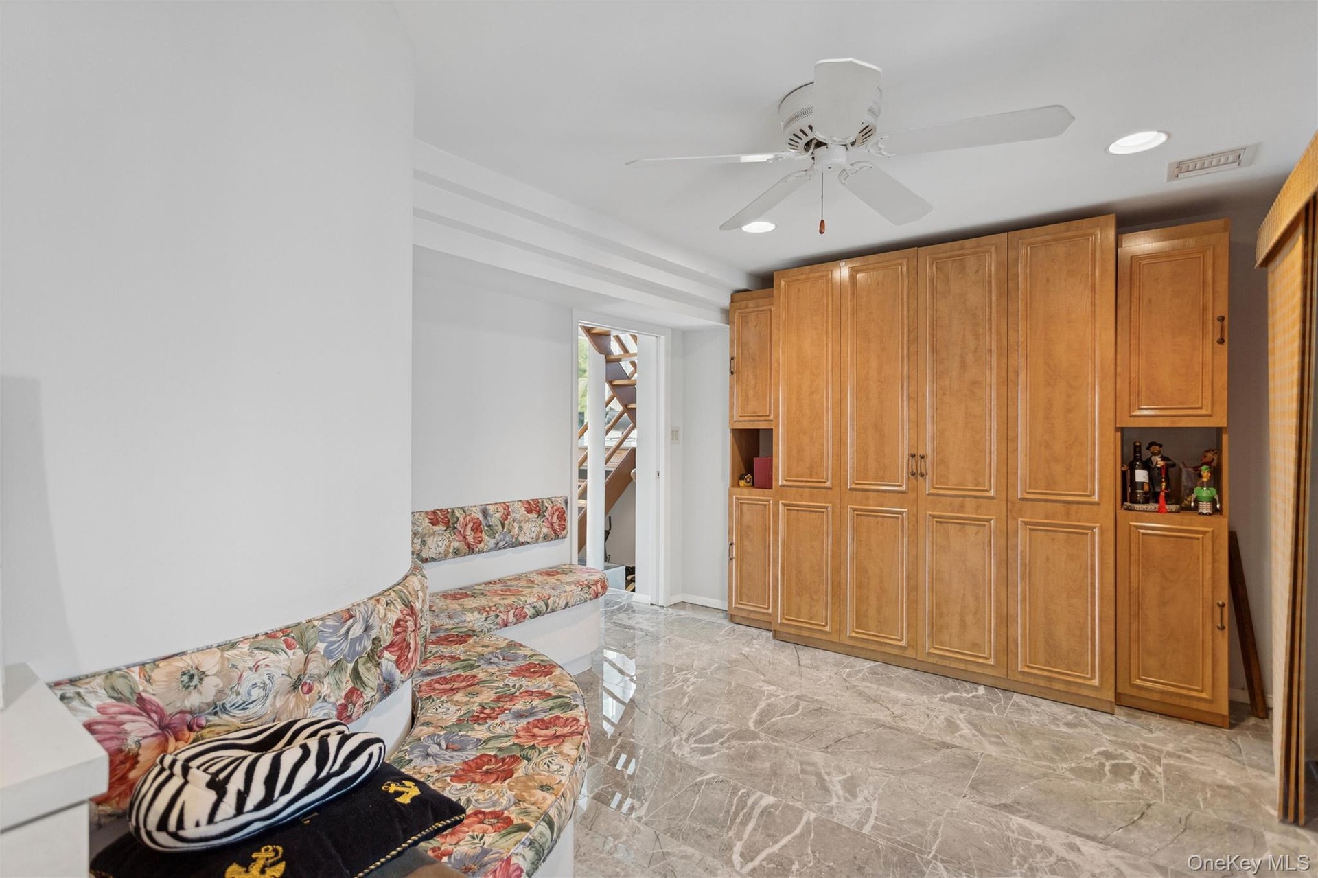 Unfurnished room with light marble finish floors, recessed lighting, and ceiling fan