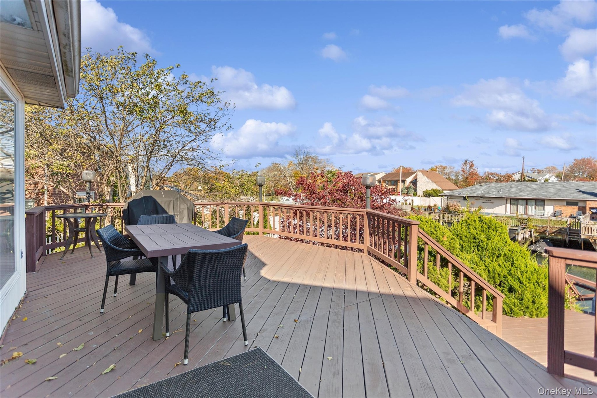 Wooden deck featuring outdoor dining area