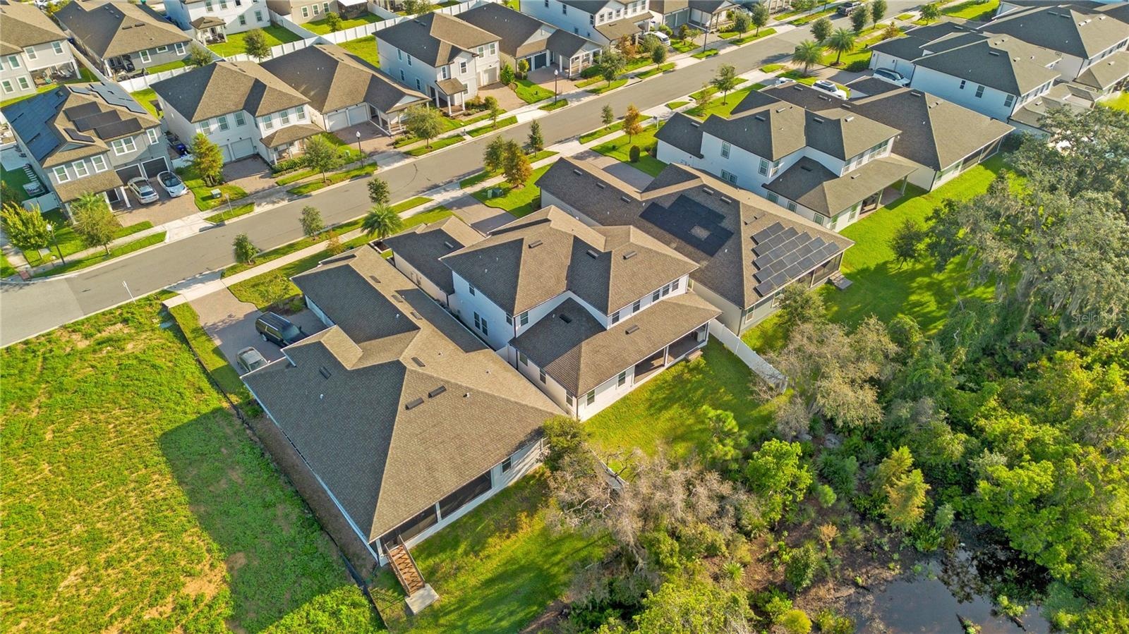 Wide aerial perspective shows the property’s location within the surrounding neighborhood.
