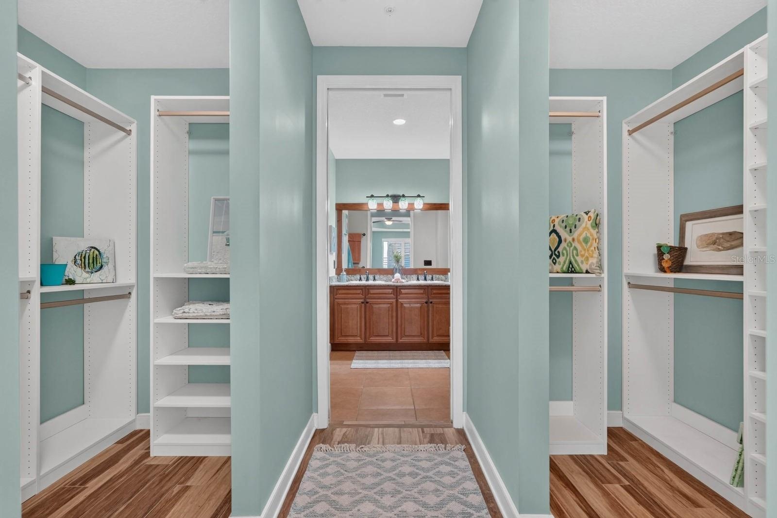 Custom dual closets in the master