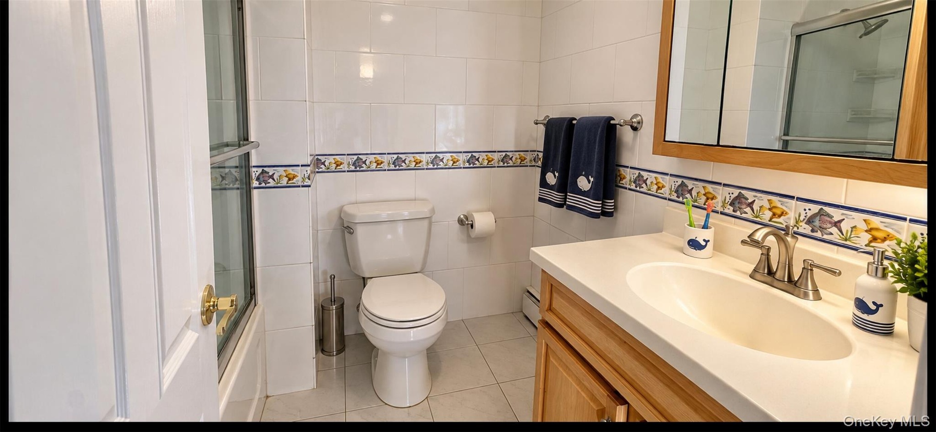 AI Enhanced Photo: Vitrually stagedBathroom featuring a wood-toned vanity with an integrated basin, white tile flooring, wall-mounted cabinetry with m