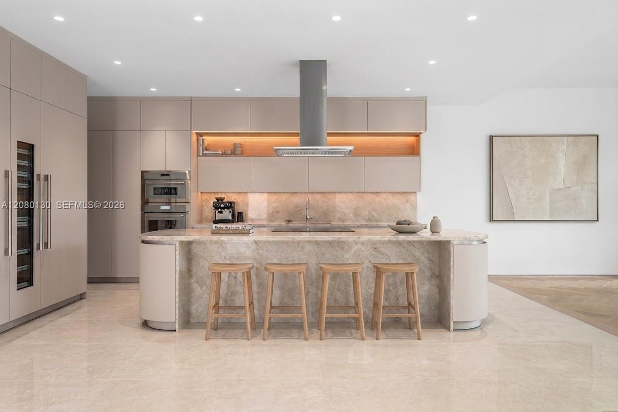 Kitchen. Disclaimer: Several photographs presented in this listing contain digitally added furniture, artwork, and decor. These virtually staged image