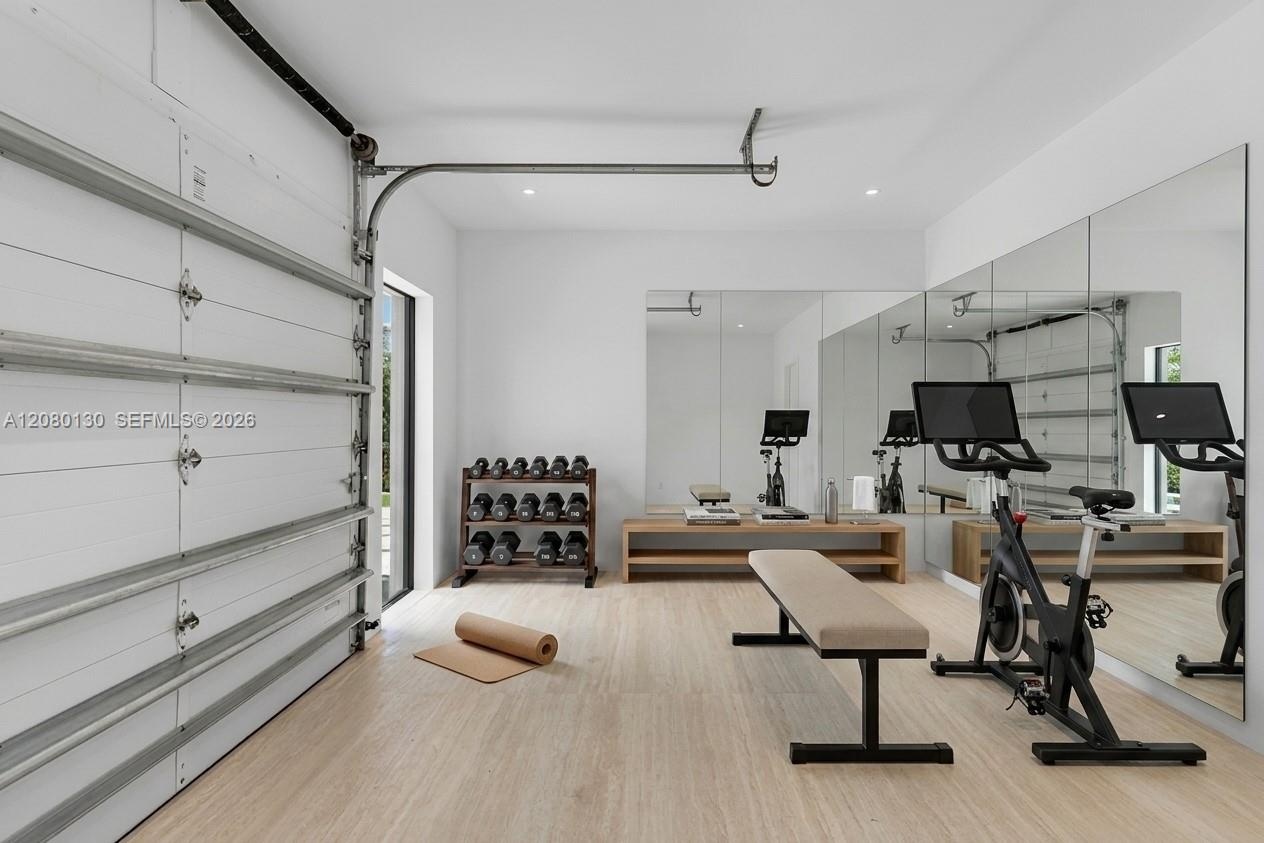 Garage/Gym. Disclaimer: Several photographs presented in this listing contain digitally added furniture, artwork, and decor. These virtually staged im