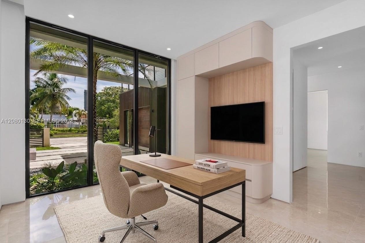 Bedroom/Office. Disclaimer: Several photographs presented in this listing contain digitally added furniture, artwork, and decor. These virtually stage