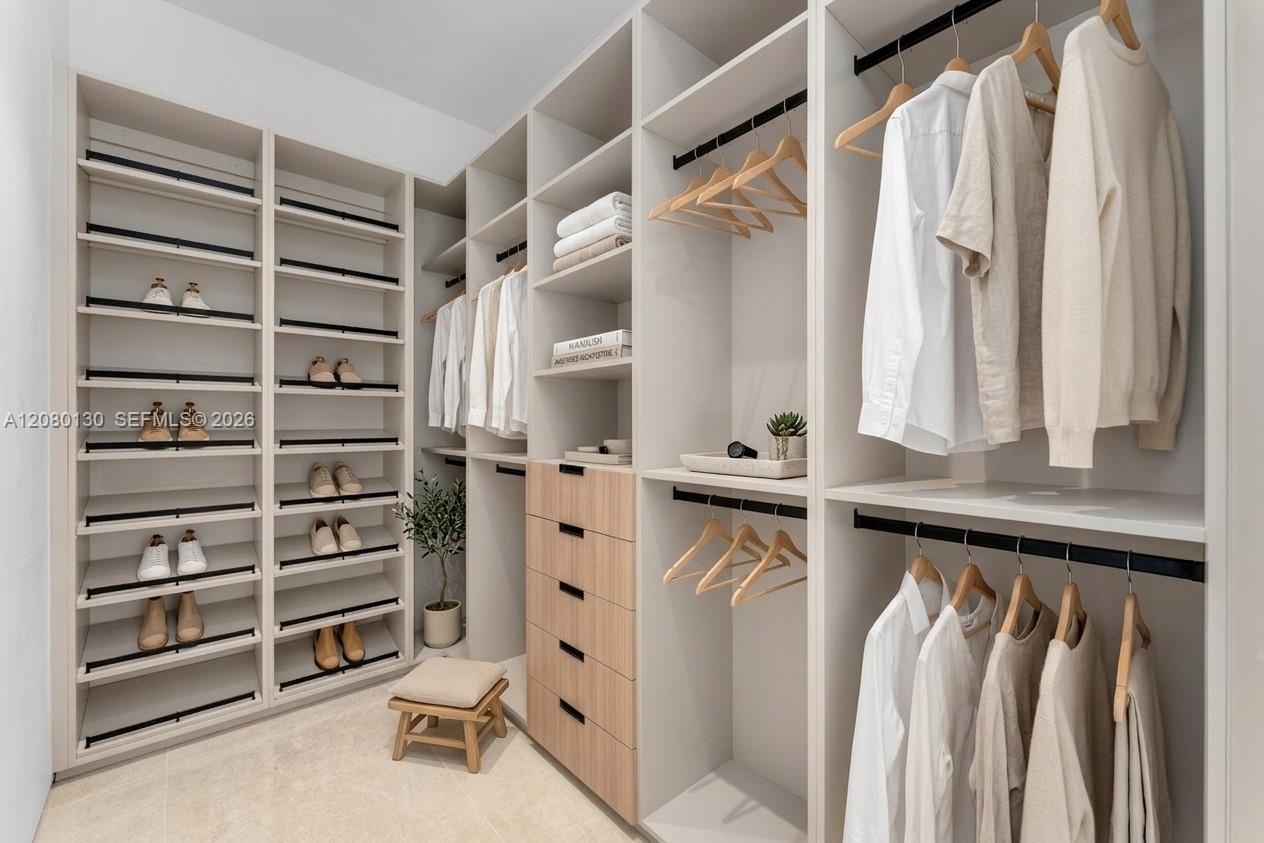 Guest Closet. Disclaimer: Several photographs presented in this listing contain digitally added furniture, artwork, and decor. These virtually staged 