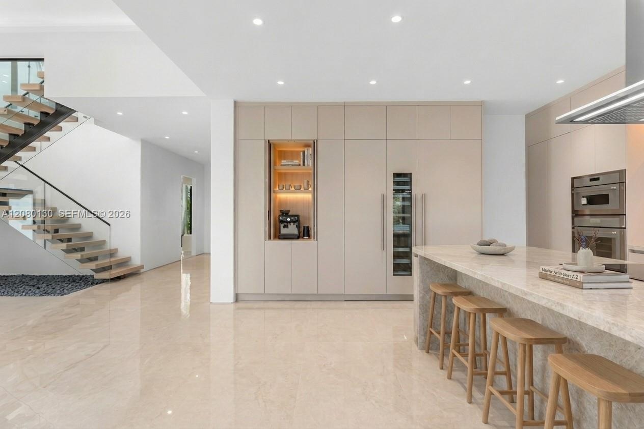 Kitchen. Disclaimer: Several photographs presented in this listing contain digitally added furniture, artwork, and decor. These virtually staged image