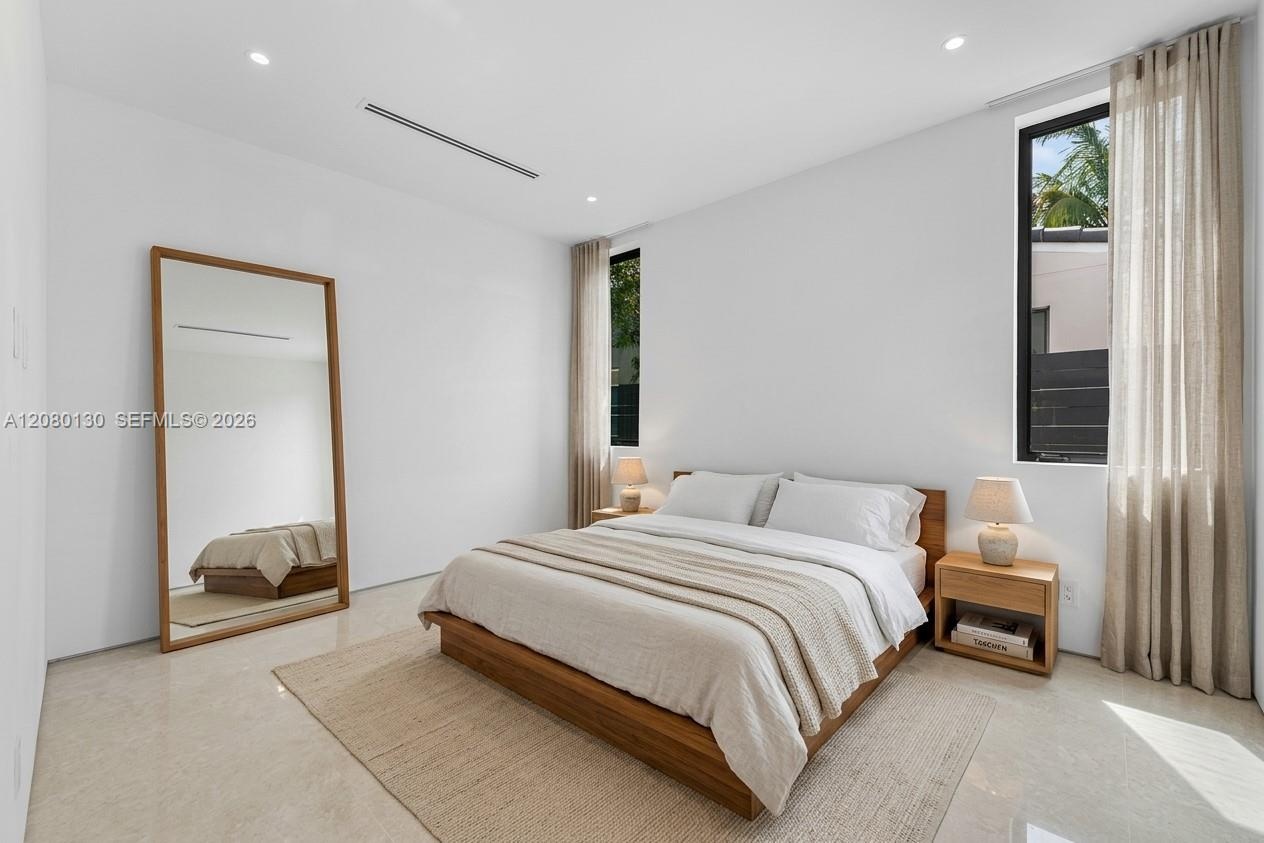 Guest Bedroom. Disclaimer: Several photographs presented in this listing contain digitally added furniture, artwork, and decor. These virtually staged