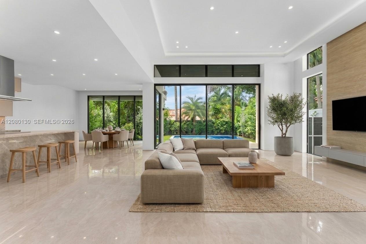 Living Room. Disclaimer: Several photographs presented in this listing contain digitally added furniture, artwork, and decor. These virtually staged i