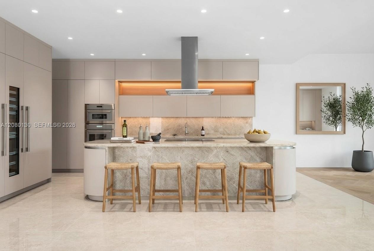 Kitchen. Disclaimer: Several photographs presented in this listing contain digitally added furniture, artwork, and decor. These virtually staged image