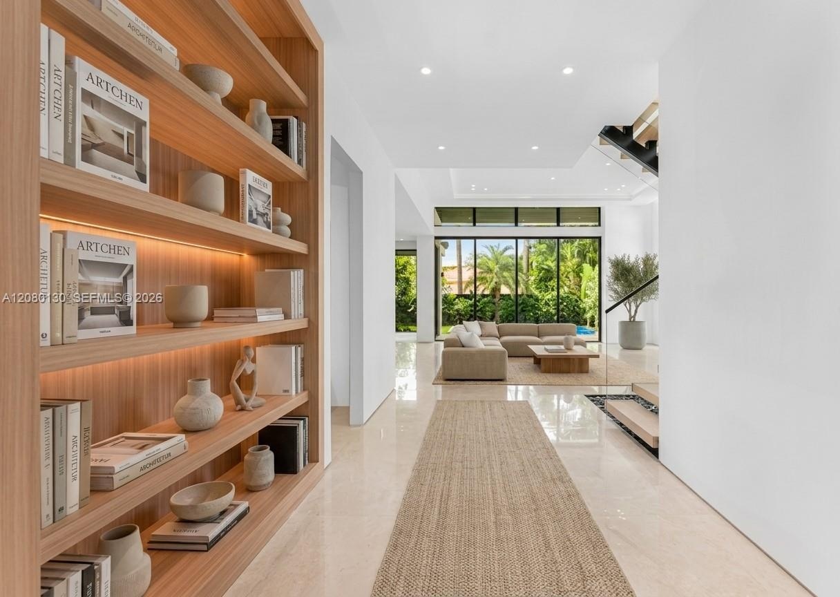 Entry. Disclaimer: Several photographs presented in this listing contain digitally added furniture, artwork, and decor. These virtually staged images 