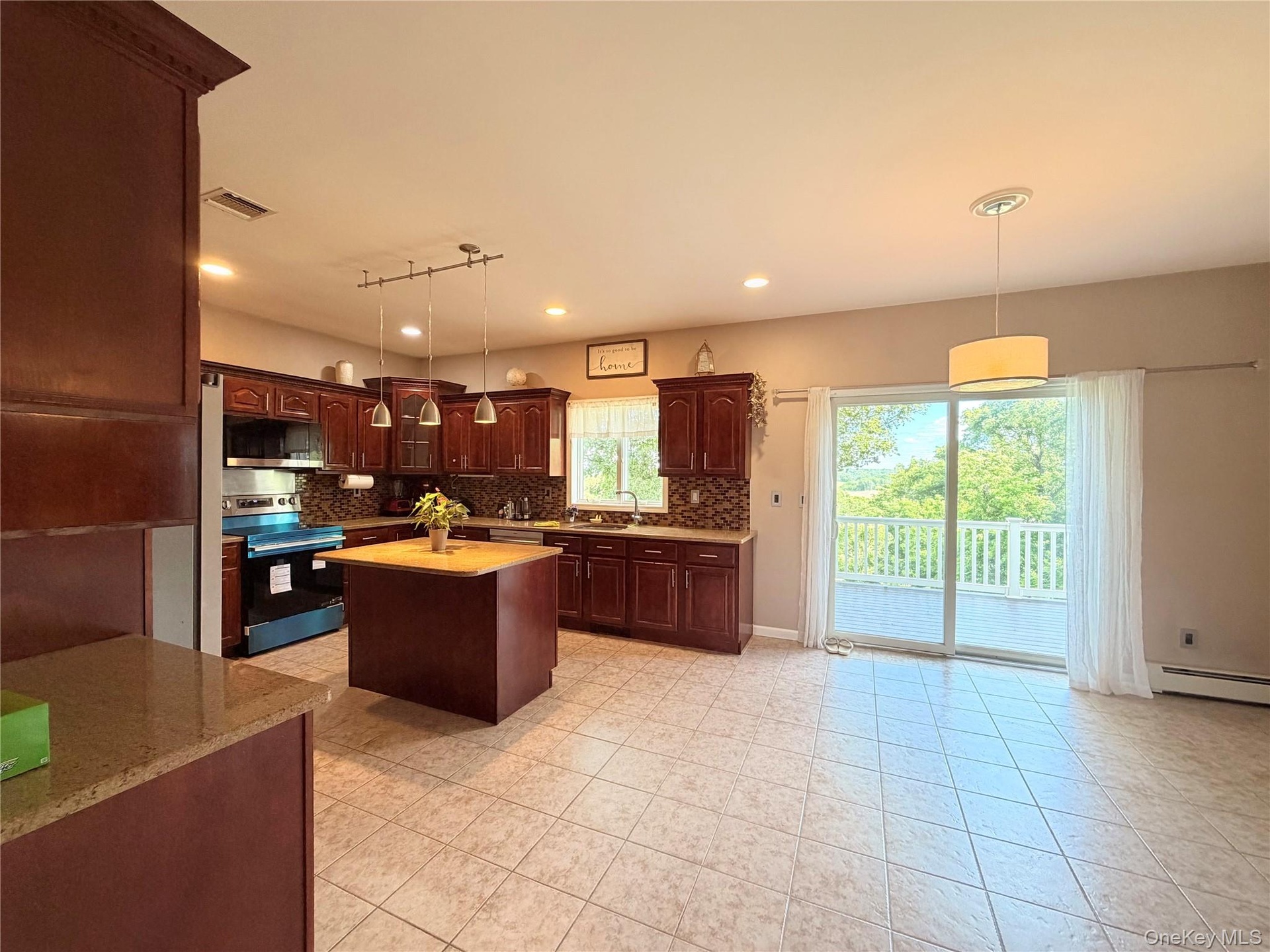 Kitchen and Dinette with slider to the deck.