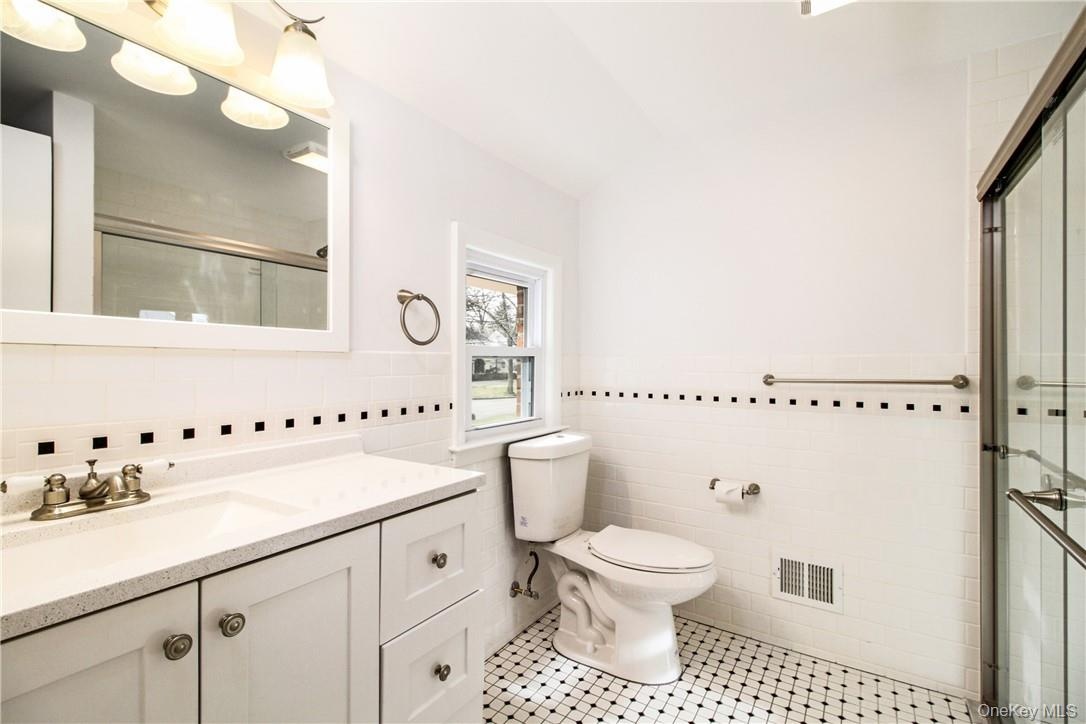 Principal suite bath with large shower. Photos taken when house was empty prior to occupancy.