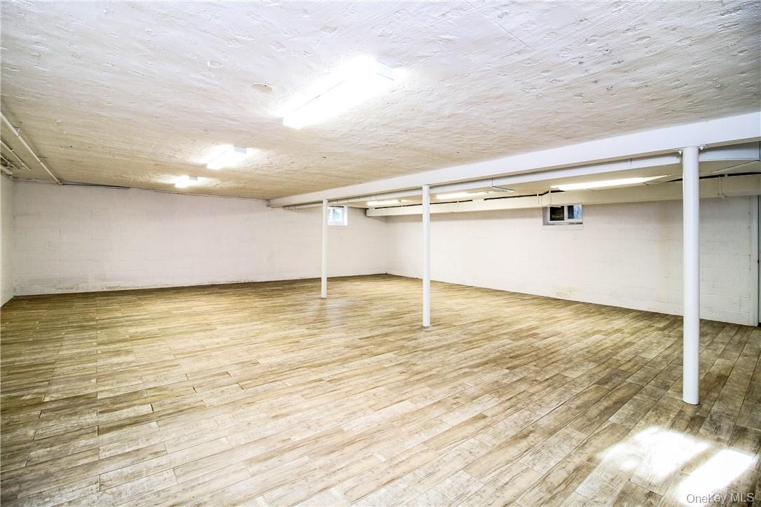 Large open space in basement with access to yard. Photos taken when house was empty prior to occupancy.
