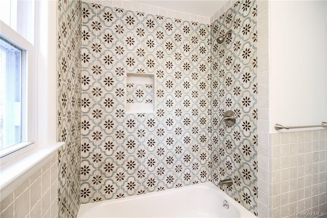 Detail of tub/shower area in hall bath. Photos taken when house was empty prior to occupancy.