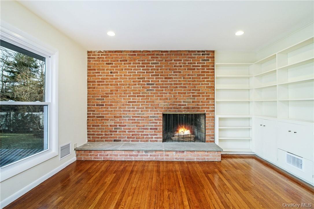 Close up of fireplace and built-ins. Photos taken when house was empty prior to occupancy.