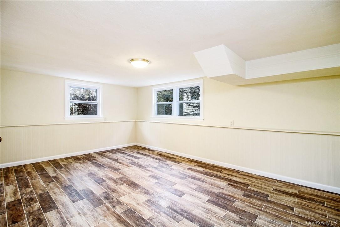 Sunny, lower level den with closet. Photos taken when house was empty prior to occupancy.