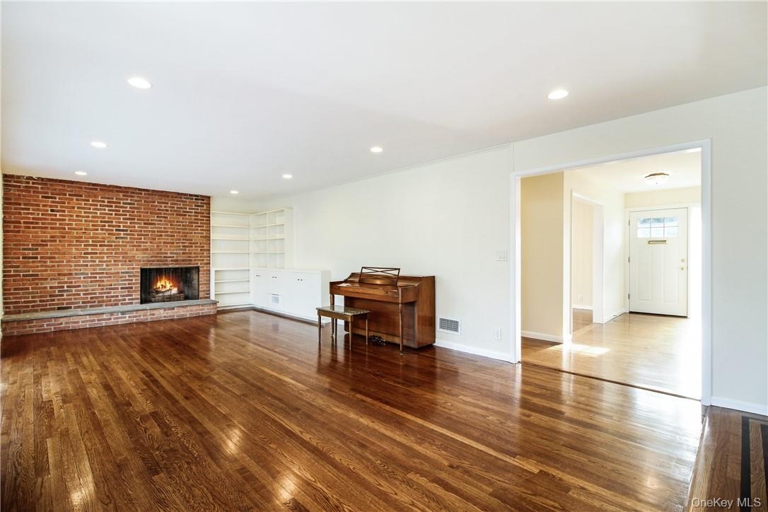 Front entry and spacious great room with fireplace. Photos taken when house was empty prior to occupancy.