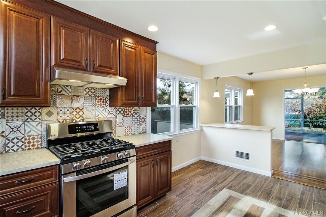 Additional view of kitchen facing dining area. Photos taken when house was empty prior to occupancy.
