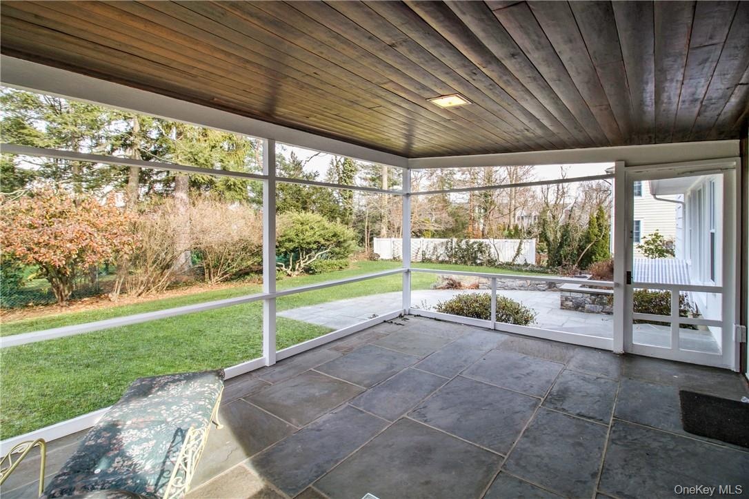 Additional view of covered screened porch. Photos taken when house was empty prior to occupancy.