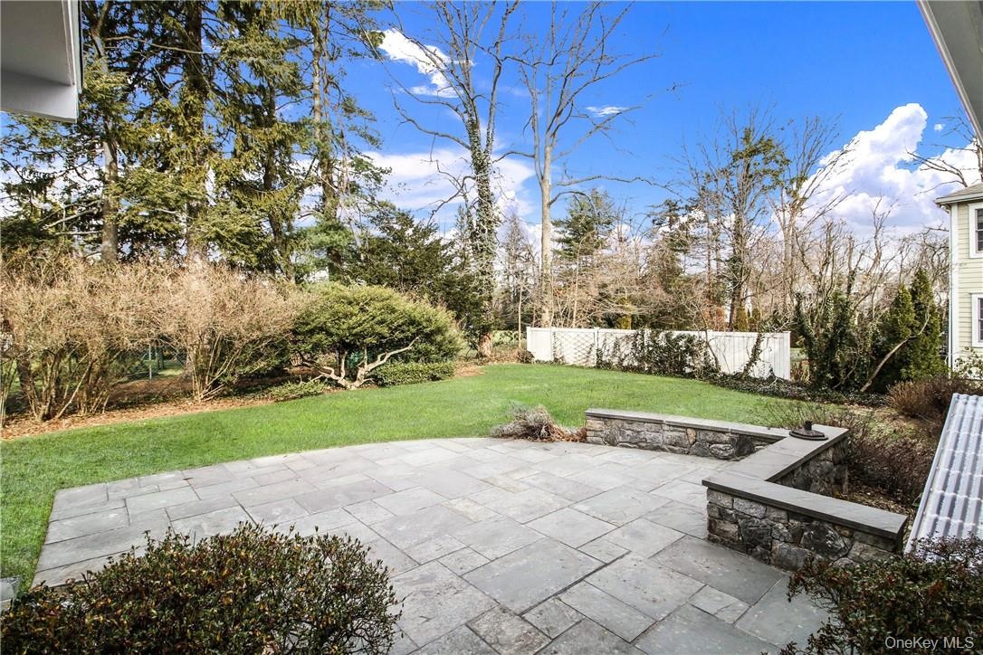 Beautiful patio for and lovely level yard. Photos taken when house was empty prior to occupancy.