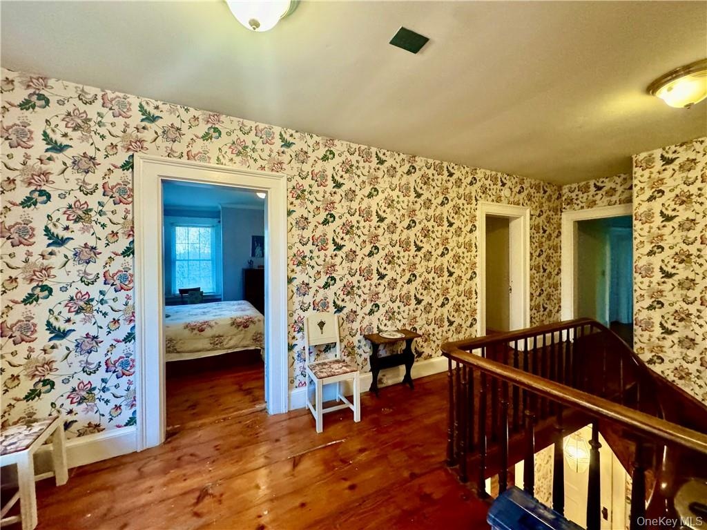 2nd floor Hallway with wood-type flooring
