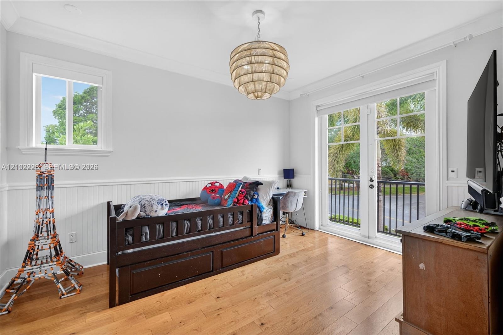 Another generously sized upstairs en suite features a charming Juliet balcony overlooking the neighborhood, a spacious walk-in closet and its own priv