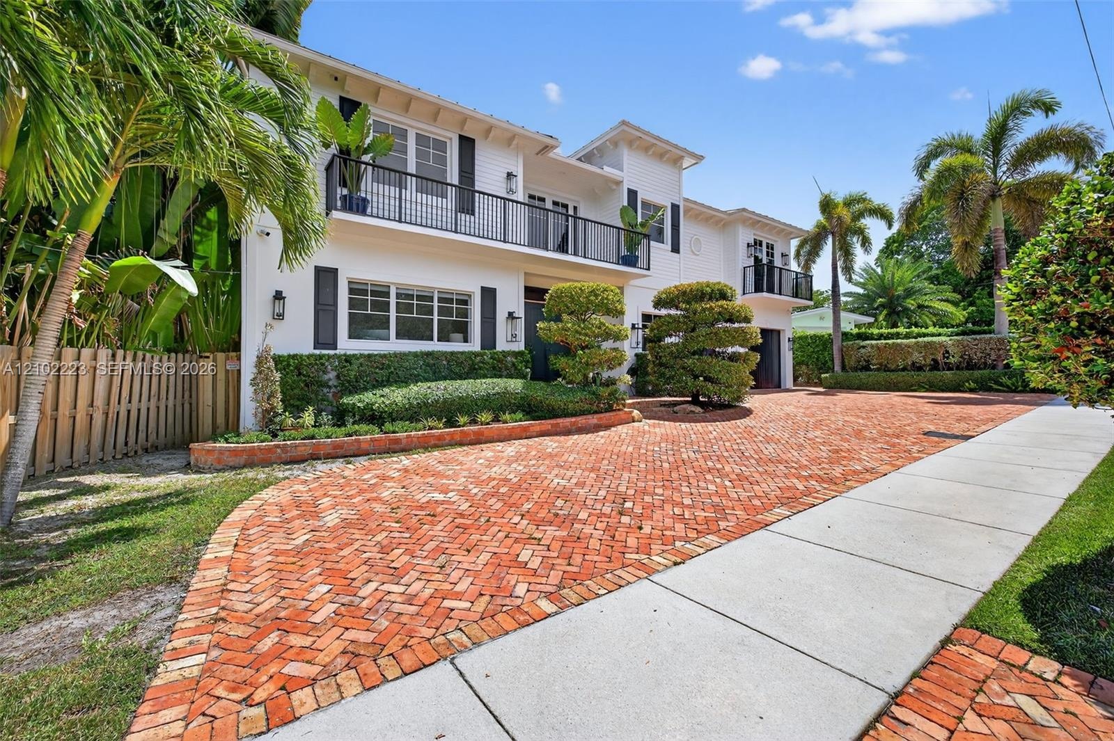 A grand exterior presence complemented by a sweeping circular brick paver driveway, a spacious two car garage and ample additional parking for guest, 