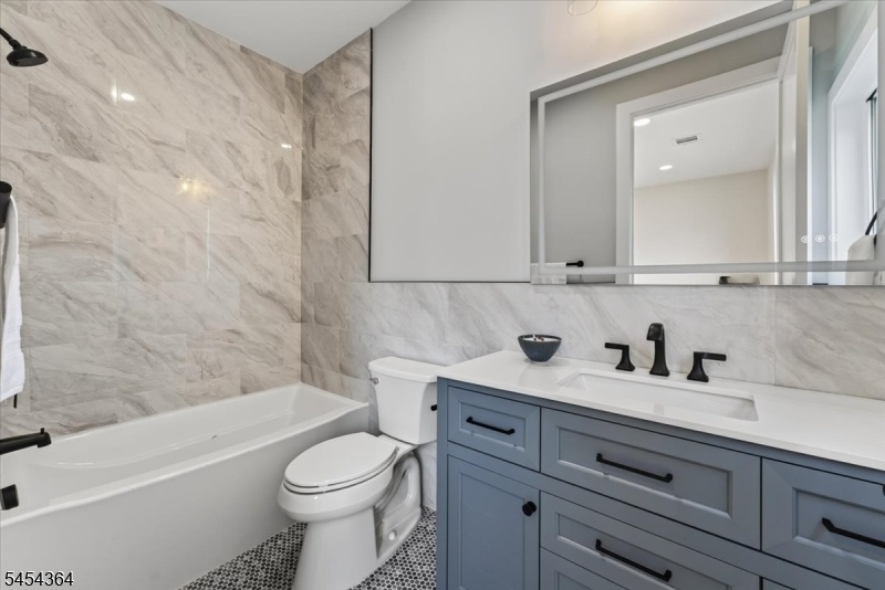 full bathroom with tub