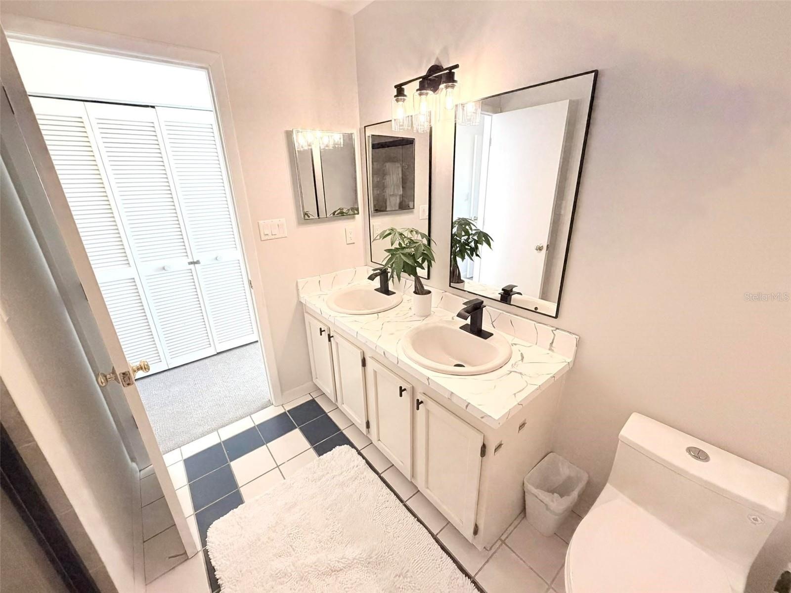 Primary Ensuite Bath with double vanity and sinks.