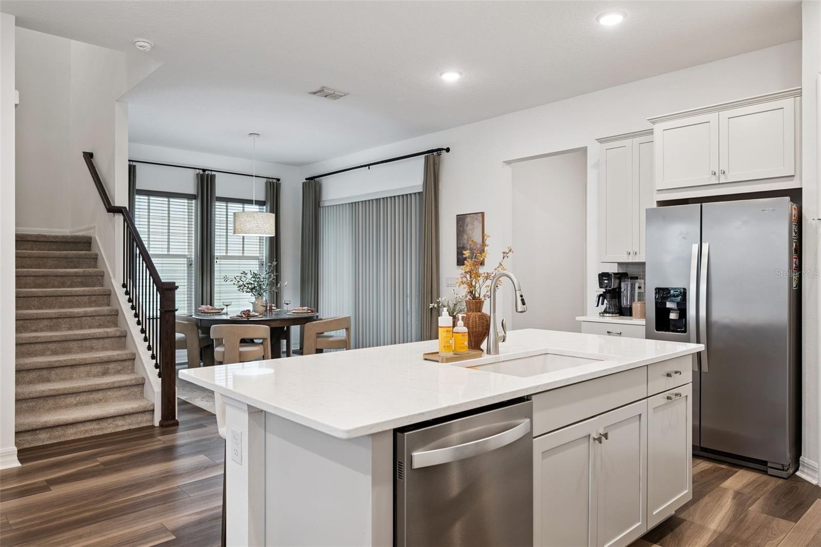 Kitchen Overlooks Living and Dining Rooms