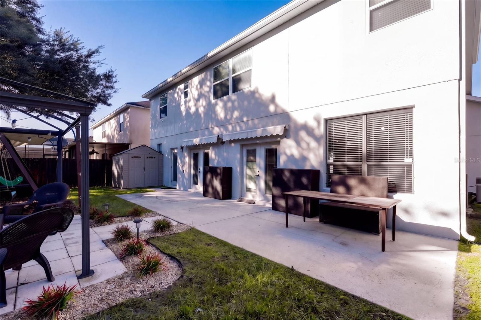 Back yard patio with double awning