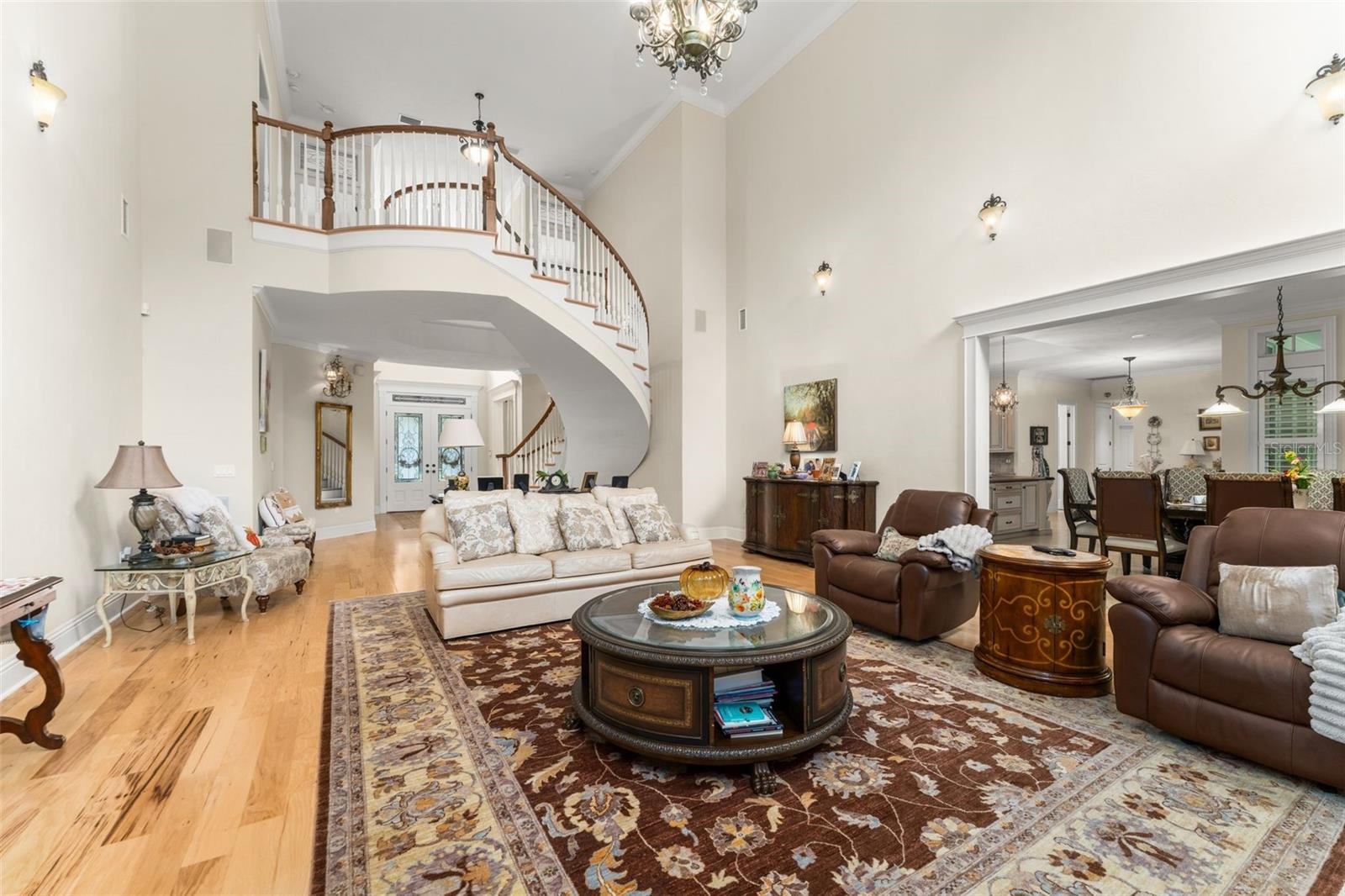Family room looking back towards foyer & floating staircase
