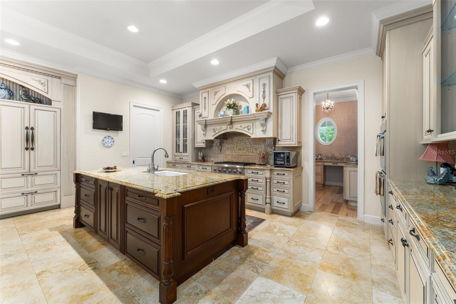 Kitchen with door leading to butlers pantry