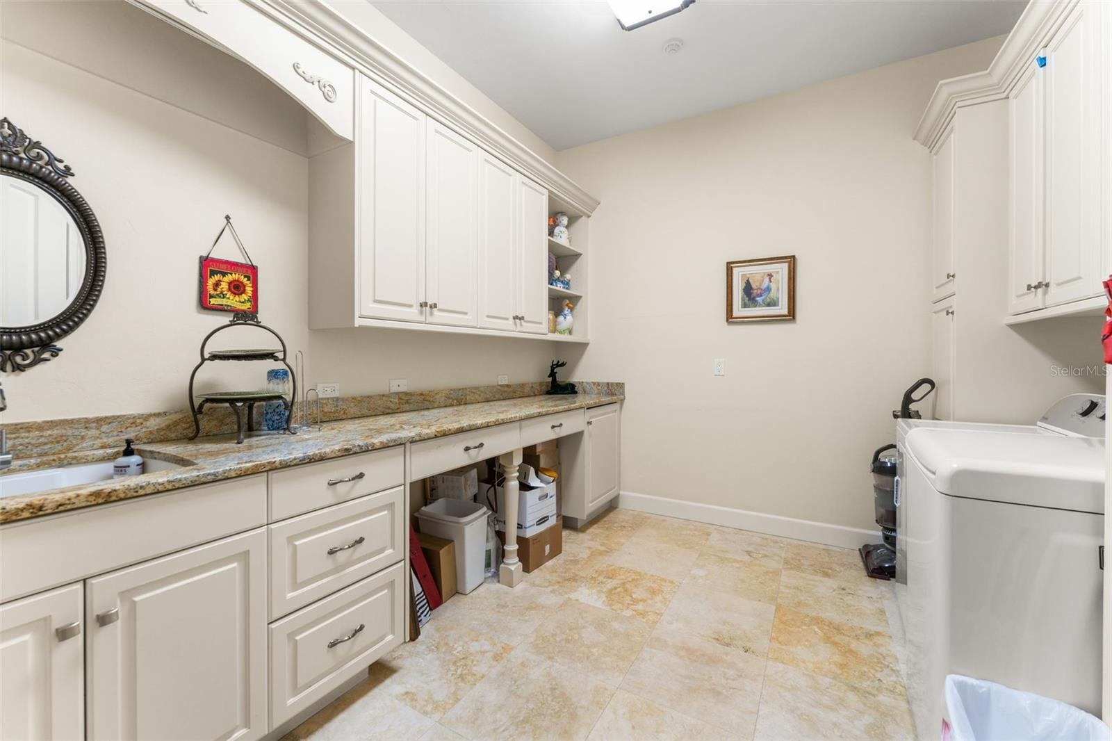 Laundry room with sink and shelving