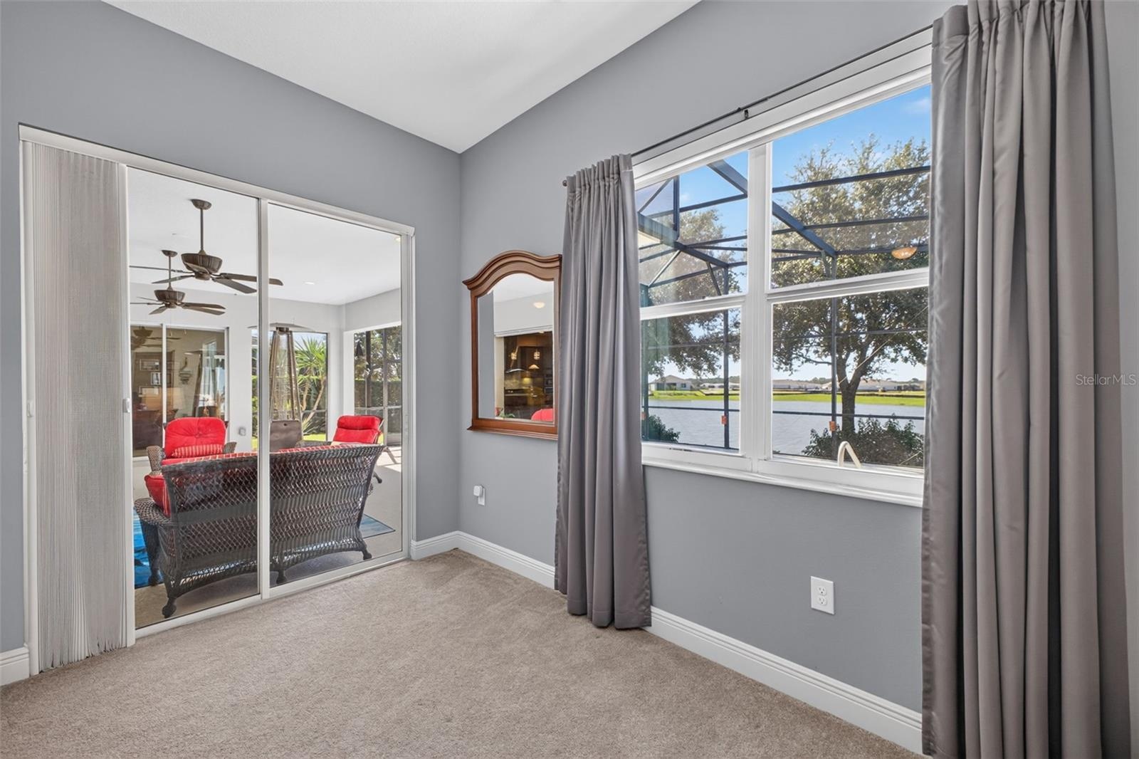 Step straight from your private primary sanctuary onto the sunlit lanai and pool deck via large sliding glass doors.