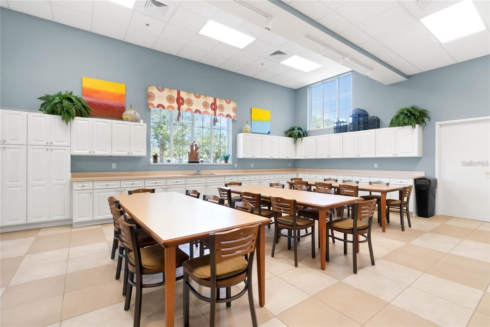 A dedicated community craft room provides a spacious, well-lit studio for artistic projects, crafting, and creative workshops.