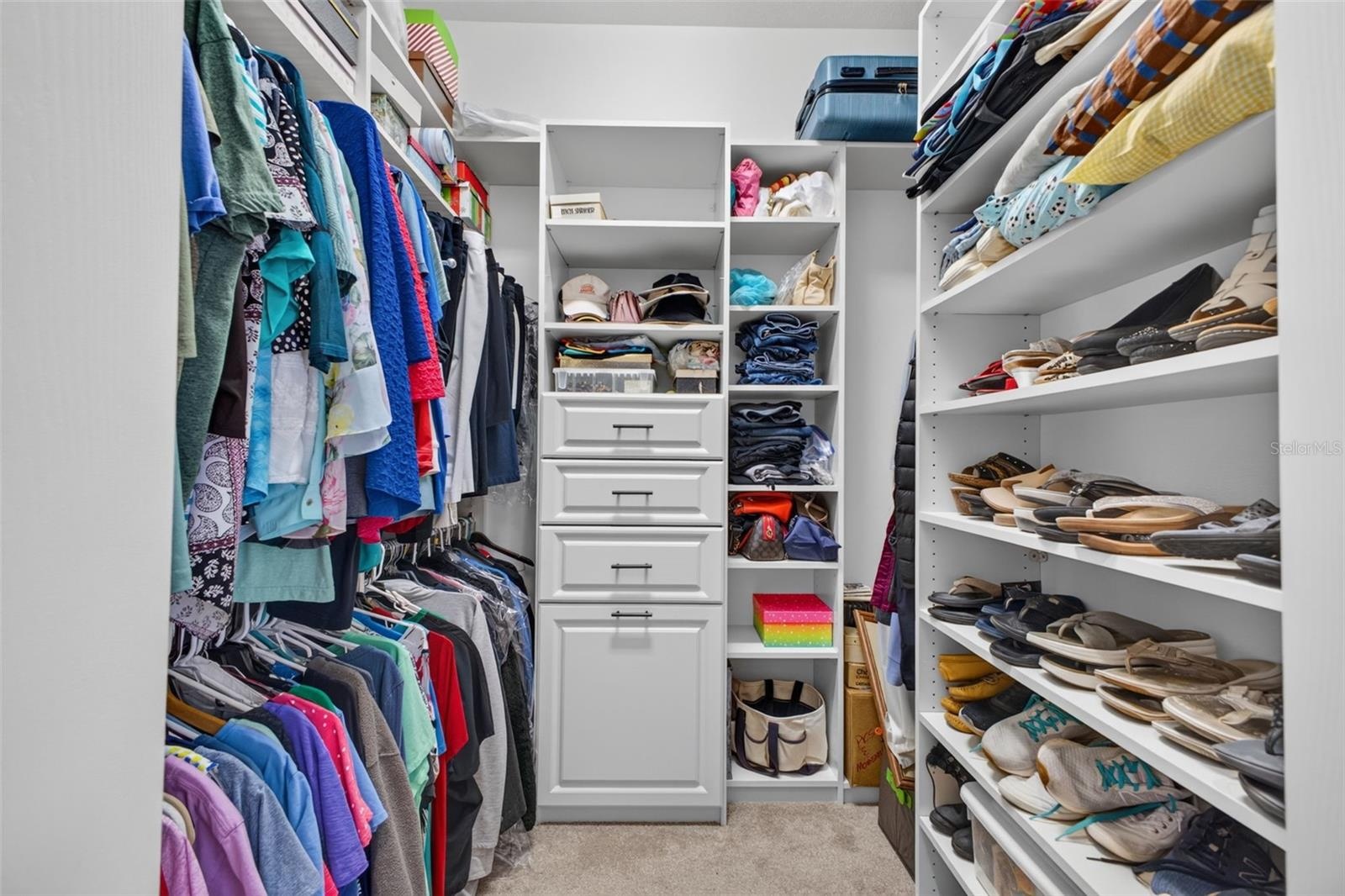 The primary suite features generous dual walk-in closets, providing ample room for extensive wardrobes and personal storage.