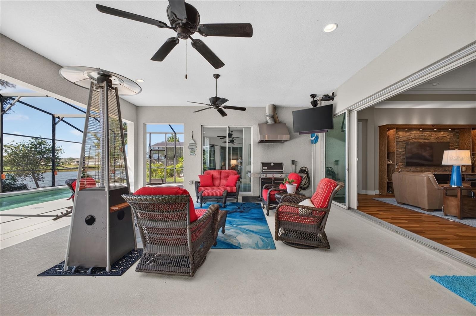 Experience quintessential indoor-outdoor living as pocket glass sliders open wide to merge the interior living space effortlessly with the covered lan