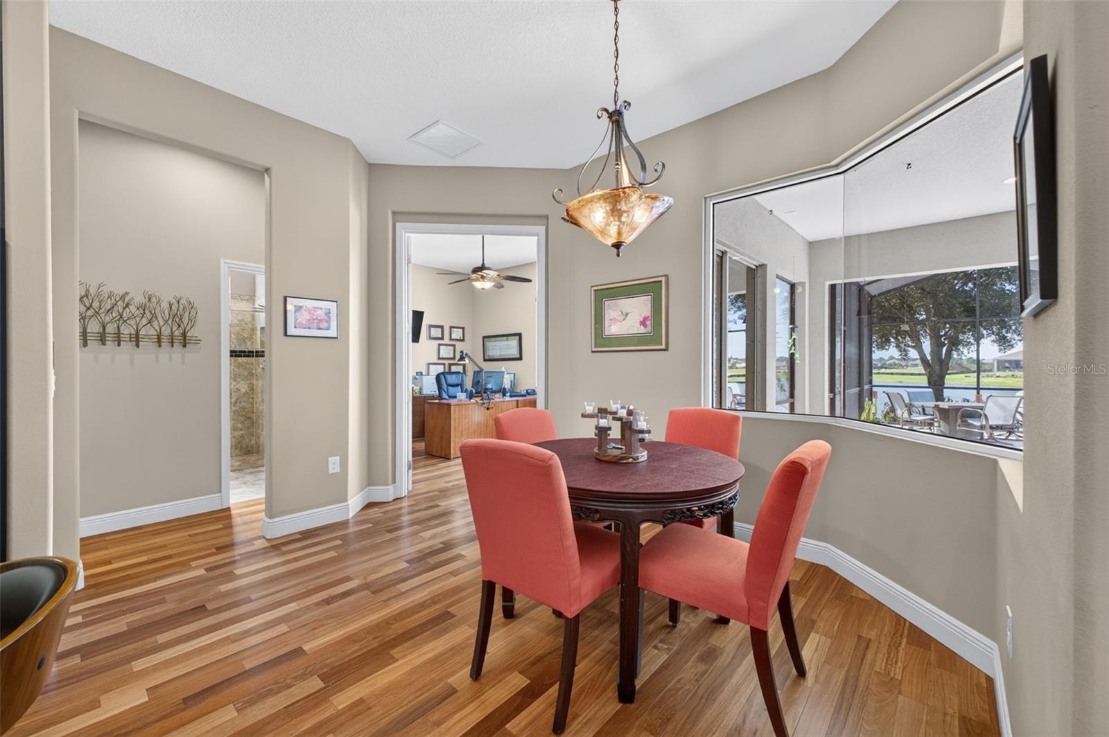 The cozy breakfast room offers a charming nook to enjoy morning coffee accompanied by serene lake views.