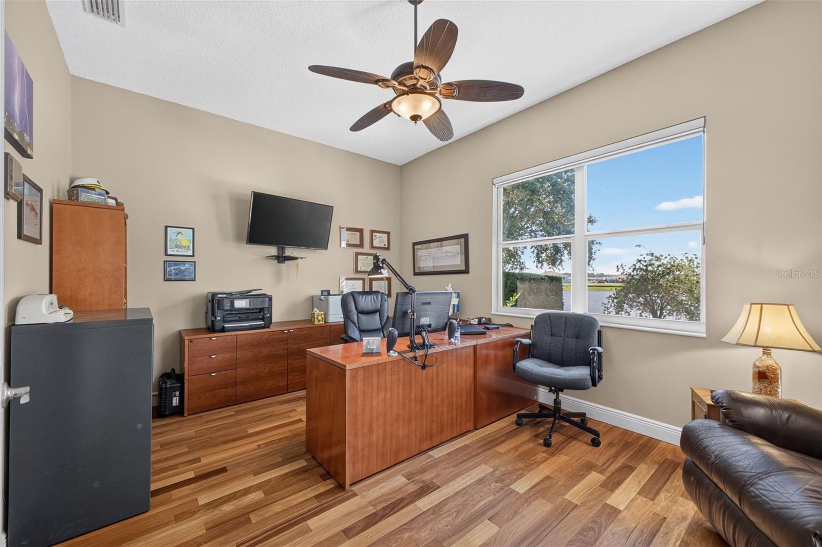 The expansive office offers exceptional flexibility, perfectly suited as a private work-from-home sanctuary, den, or library.