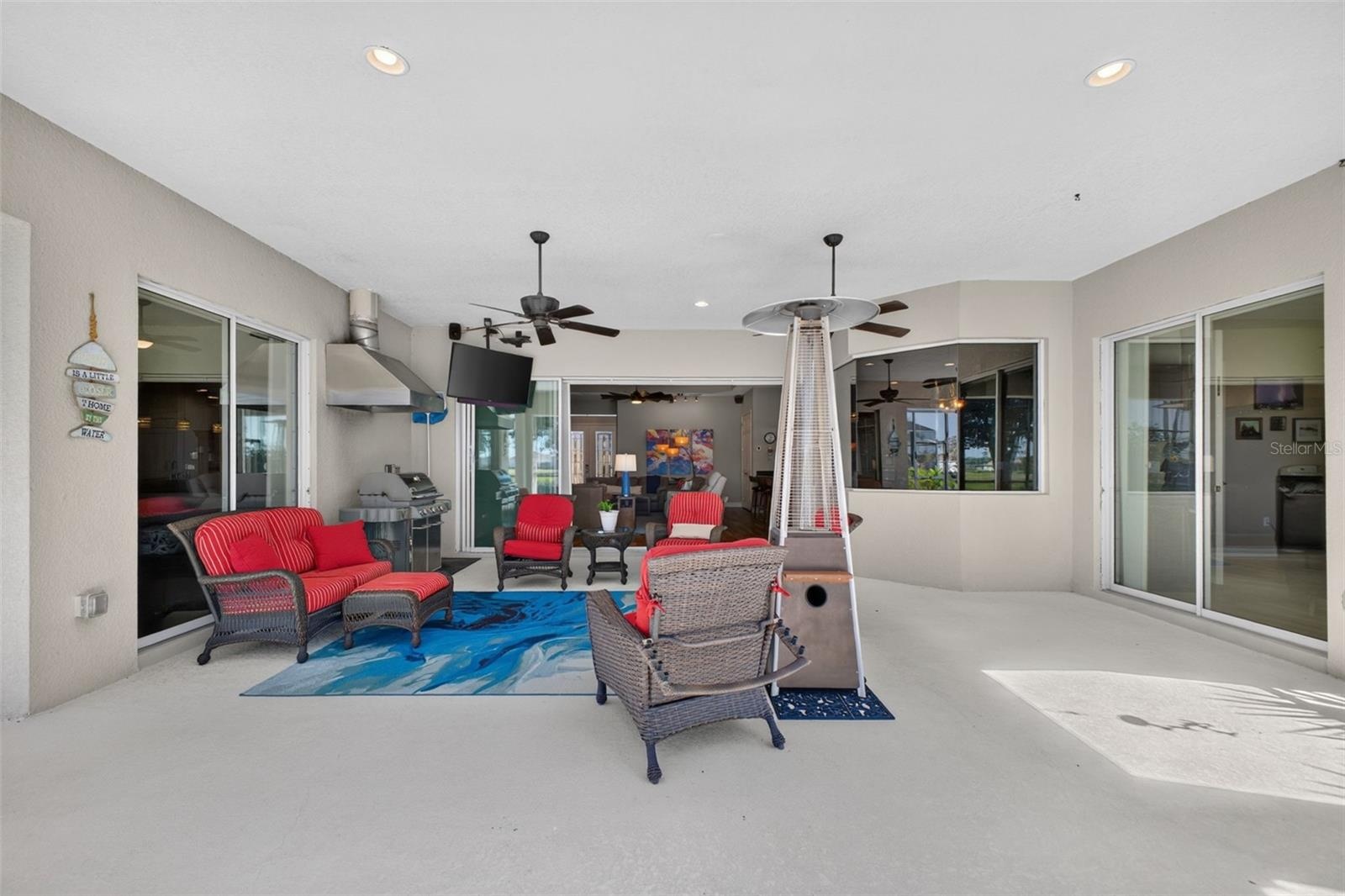 Designed for resort-style relaxation, the spacious covered lanai provides a seamless outdoor living area perfect for post-pool lounging and entertaini