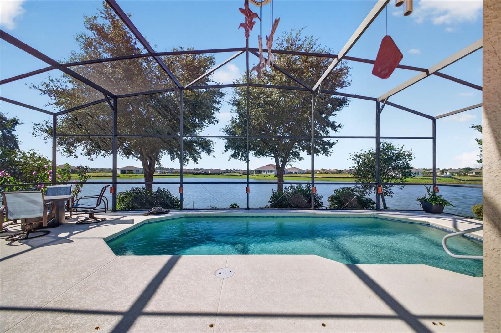 Take a refreshing dip in the pool while taking in the vibrant waterfront activity on the lake.
