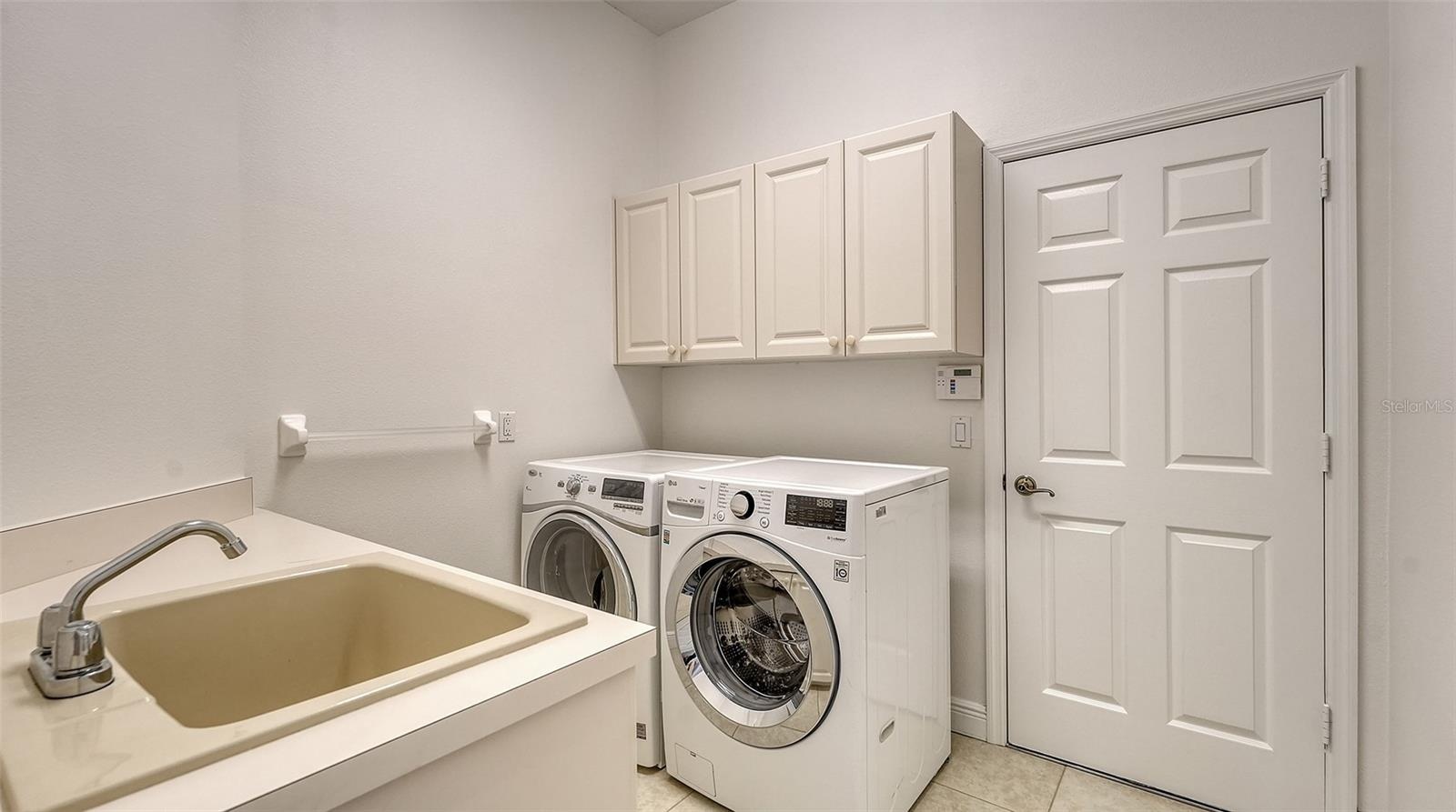 Laundry room with newer washer and dryer