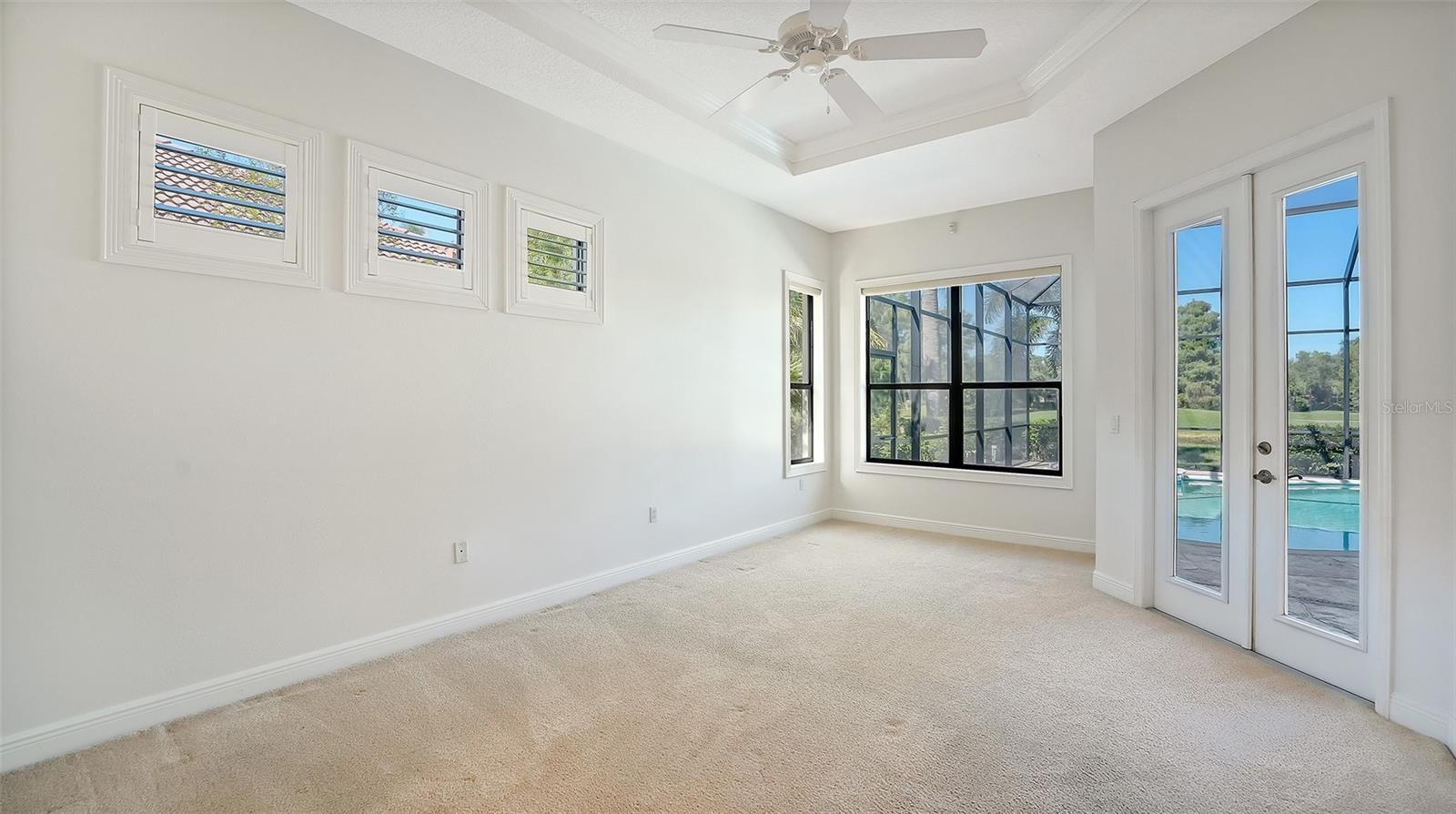 Master bedroom with lots of natural light and double french door to the lanai