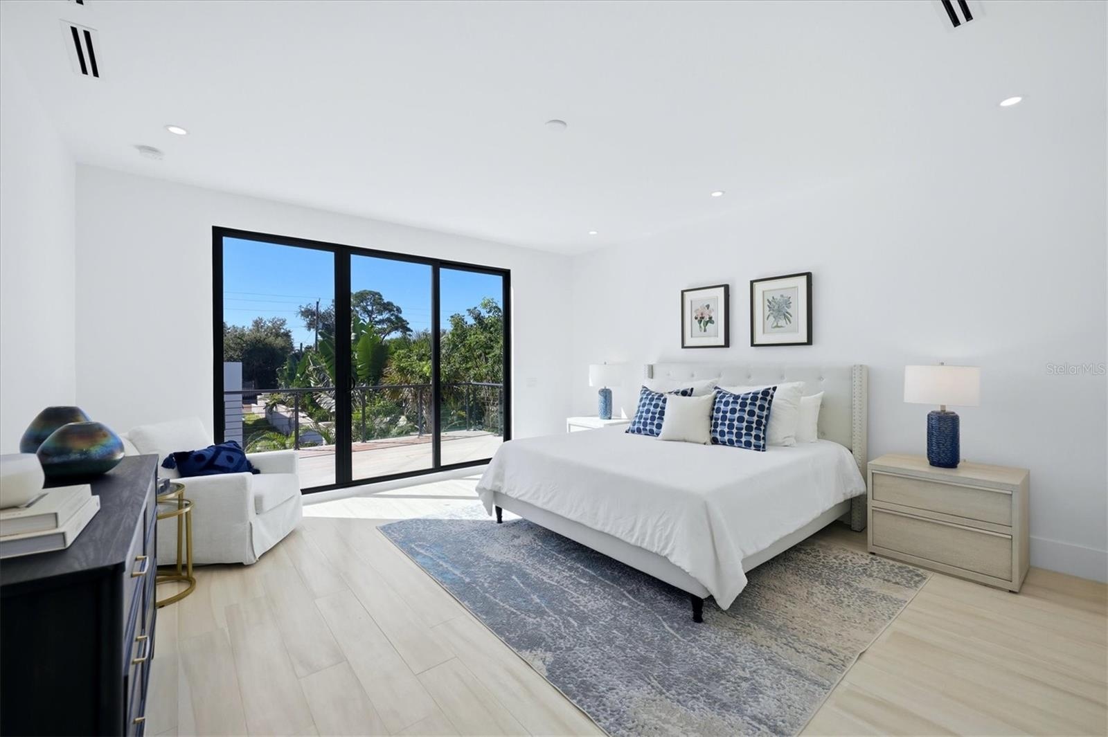 primary bedroom with ensuite bathroom and two walk in closets