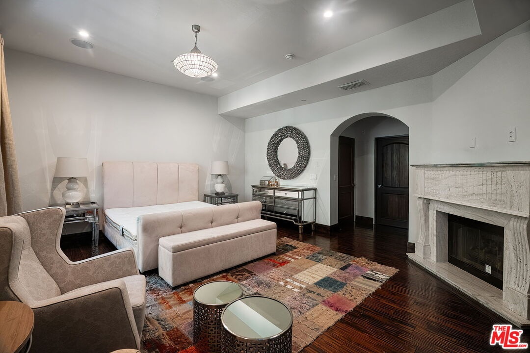 Spacious bedroom with fireplac