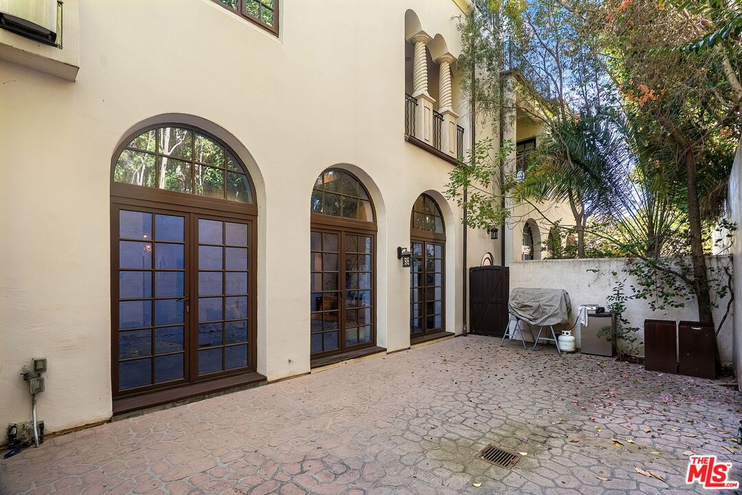 Private backyard with arched F