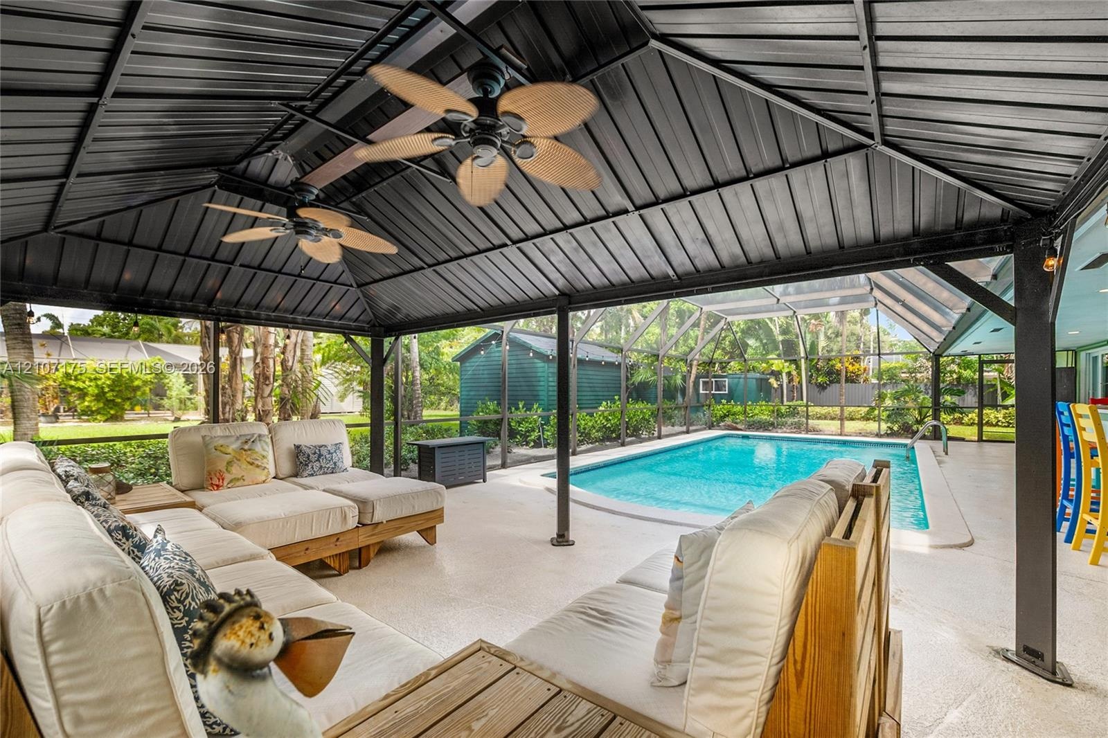 Pavilion featuring dual ceiling fans and custom made furniture.