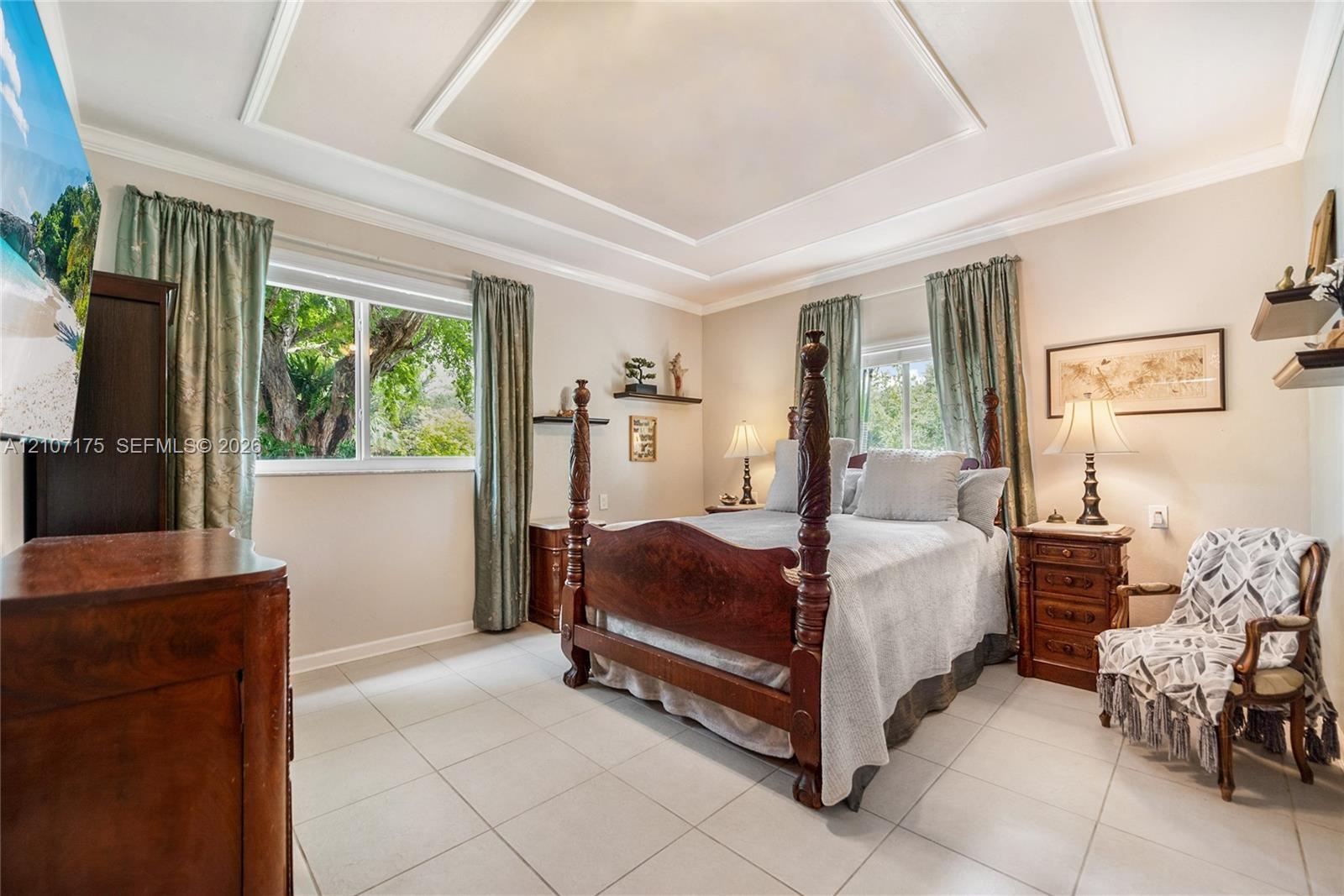 4th Bedroom en-suite could be used as 2nd primary, guest, inlaw or home office. Tray ceiling featuring decorative crown molding, large-format tile flo