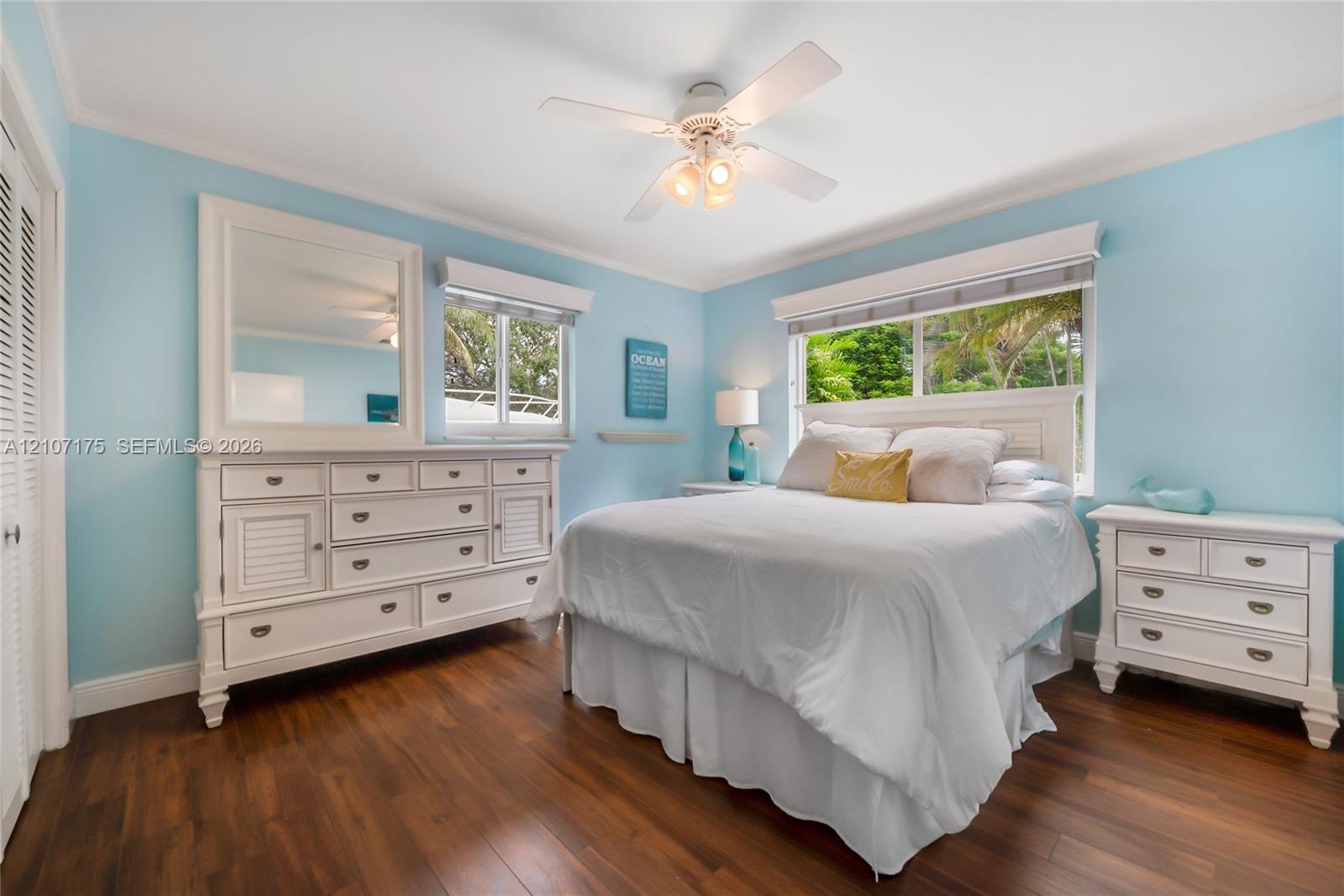Spacious 3rd bedroom has blinds and sliding impact windows.